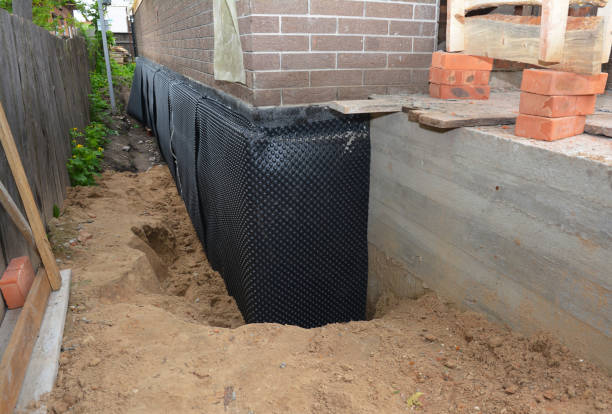 Happy homeowners after waterproofing job in Walled Lake